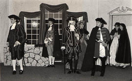 Students in costume acting in a dramatic production