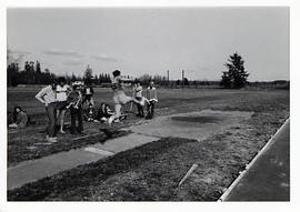 Track and Field Team member attempting a long-jump