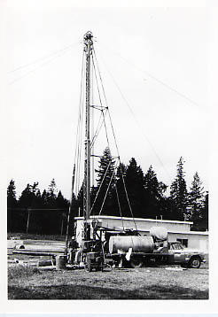 Drilling rig near the maintenance shed