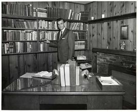 President Calvin B. Hanson standing in his office