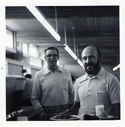 Two staff members in the cafeteria