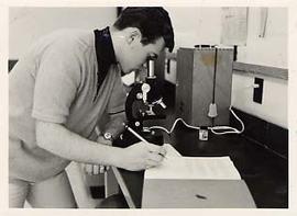 Student looking in a microscope