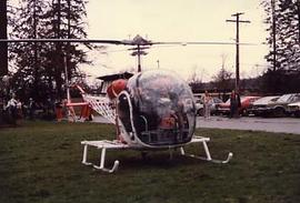 Dr. R. Neil Snider arriving in a helicopter