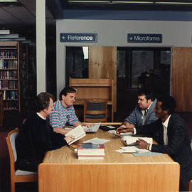 Seminary students at a library table