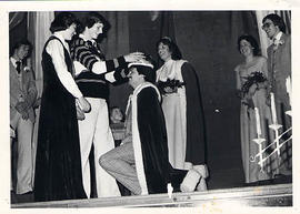 Retiring king crowning new king during Homecoming 1977