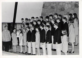 Concert choir posing in the chapel