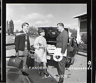 Calvin Hanson helping students unpack a car