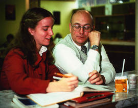 Norman Handy working with a female student