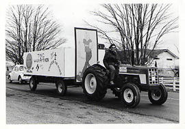 Tractor pulling a trailor decorated for TWC Walk-a-thon