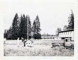 People working in the field beside the Chapel