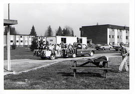 Students seated on a pick-up truck during the Work-a-thon