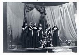 A women's sextet performing in the gym