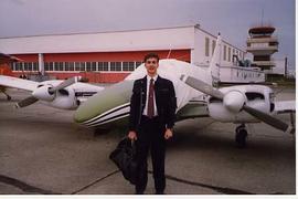 Don Fossum posing with an airplane