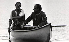 Two staff members in a canoe