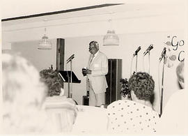 Calvin Hanson speaking in lower café