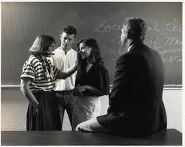 Craig Seaton and Barbara Pell with two students