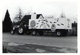 Tractor pulling a trailor decorated for TWC Walk-a-thon