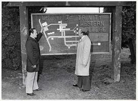 Dr. Snider pointing to the new administration on the campus map