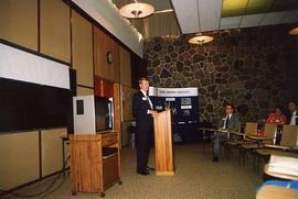 Don Page speaking at a reception