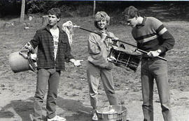 Students with mops during a student leadership retreat