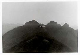 An airplane flying over the mountains