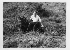 Robert Thompson on a fallen tree on assignment during the Biafran Civil War.