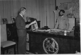 Robert Thompson presenting his commission report to Emperor Haile Selassie.